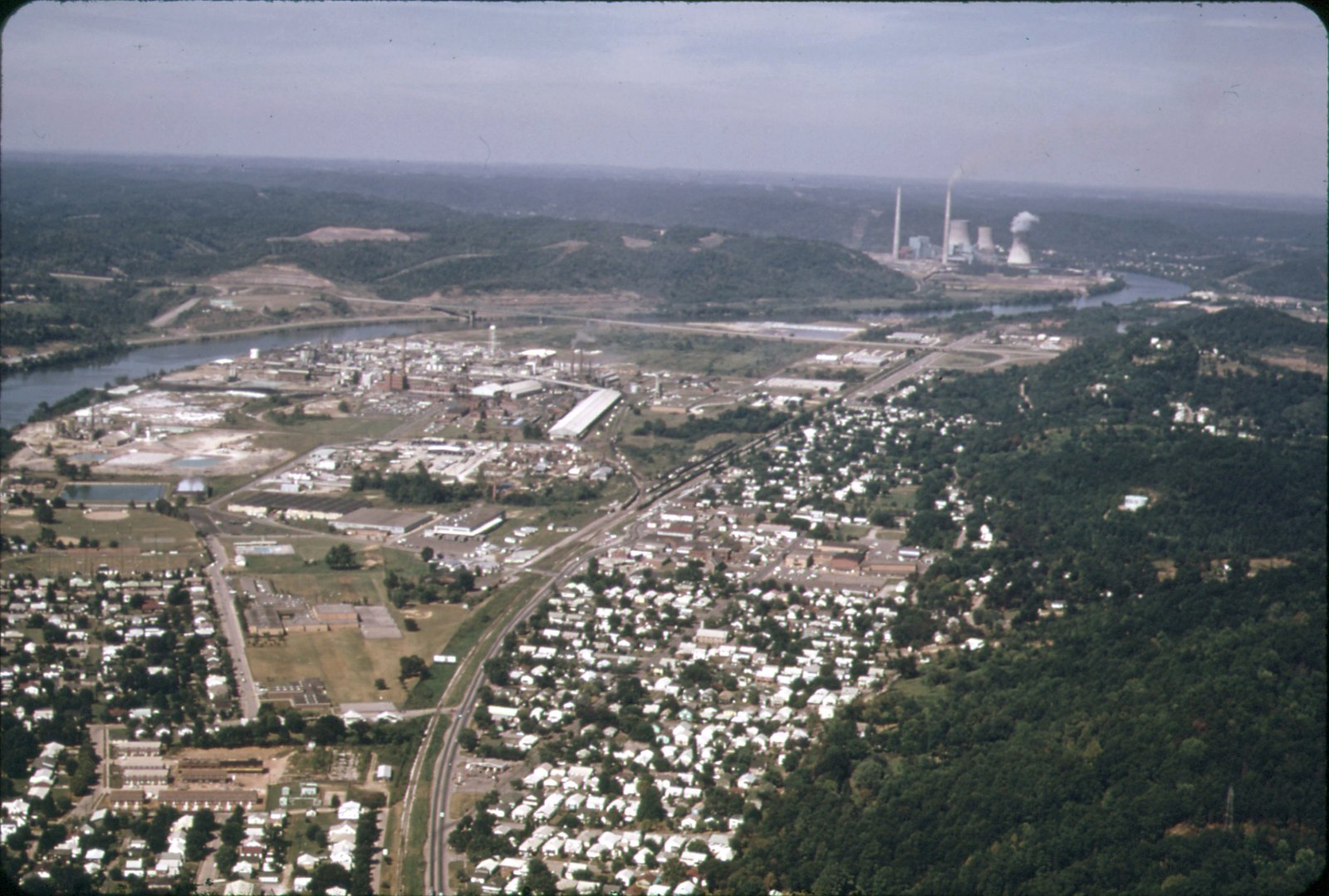 Aerial view of Nitro, West Virginia and the chemical plant beside it, 1973