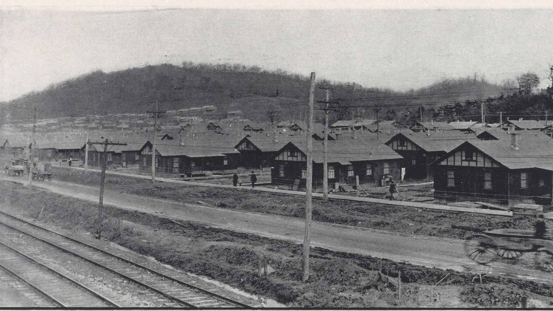 Rows of identical workers' bungalows along a railway line at Nitro, West Virginia, 1920